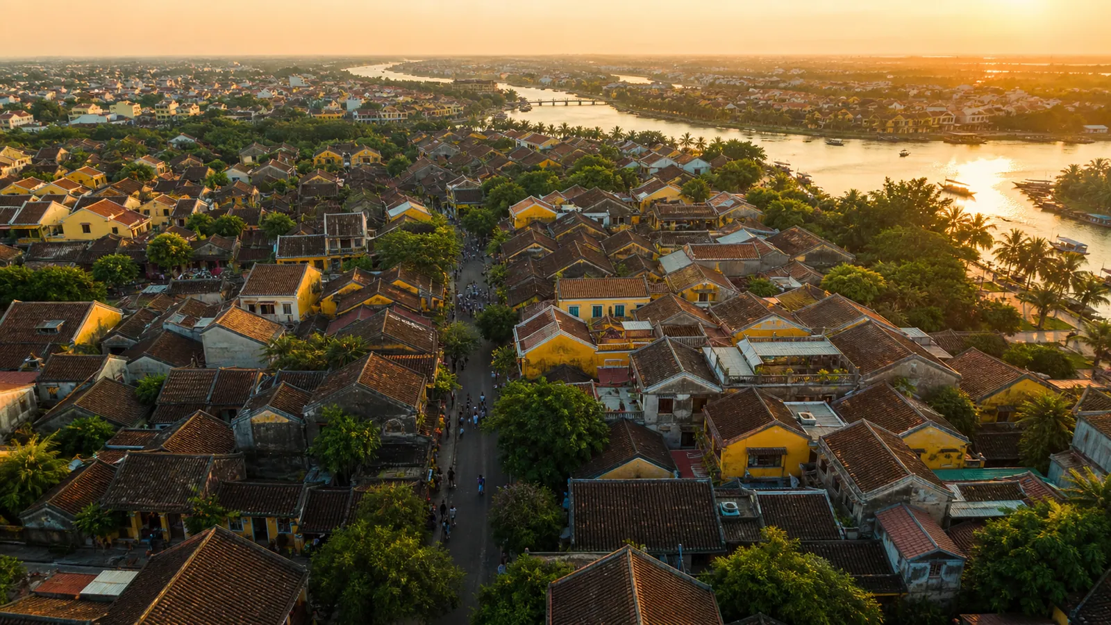 Hoi An ancient town and the Thu Bon river from the air at sunset